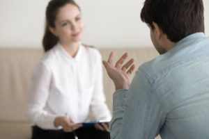 Female psychologist consulting male patient