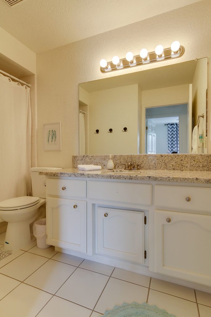 White bathroom with a large vanity