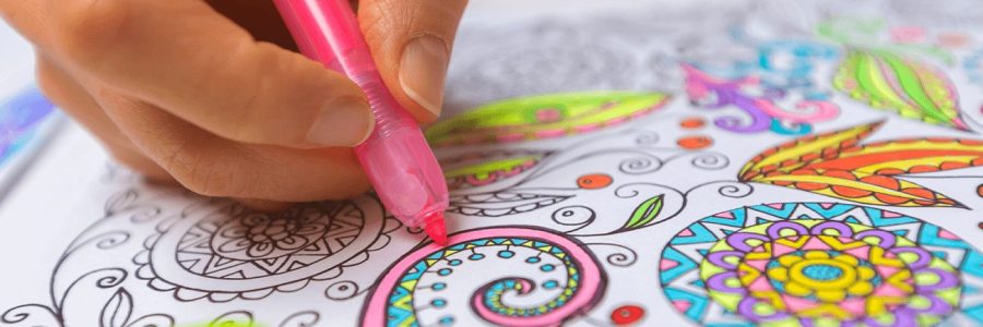 a person coloring with a pink highlighter