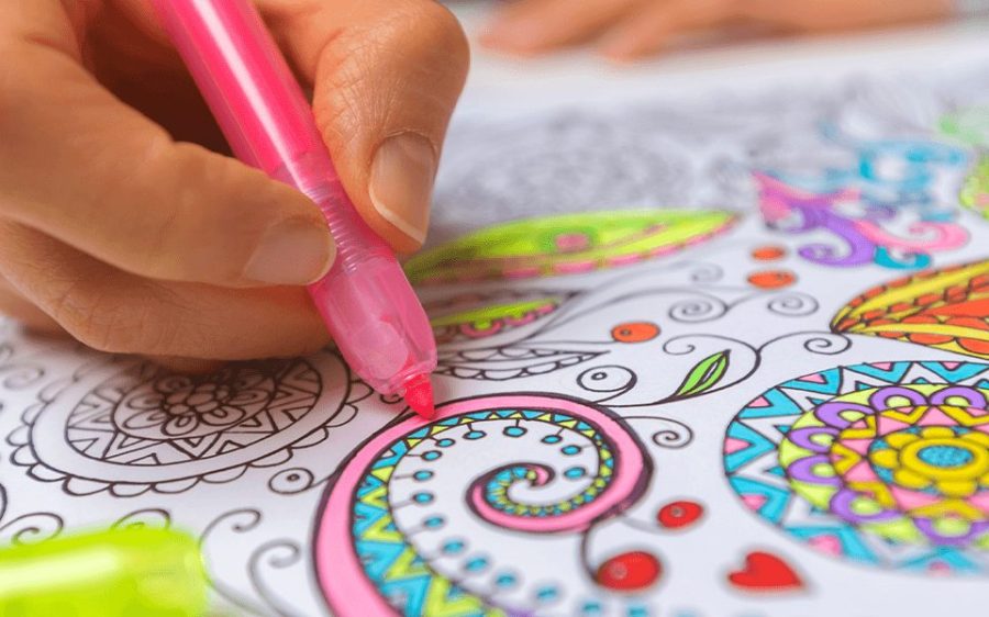 a person coloring with a pink highlighter