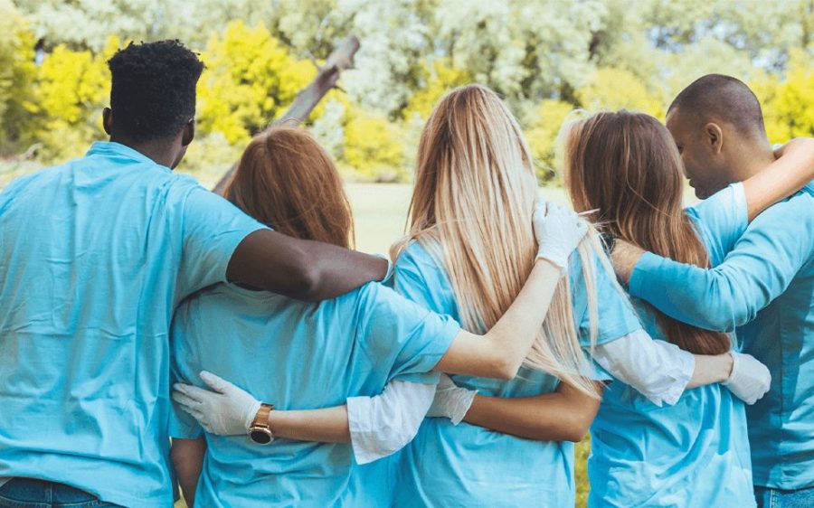 a group of volunteers standing outside